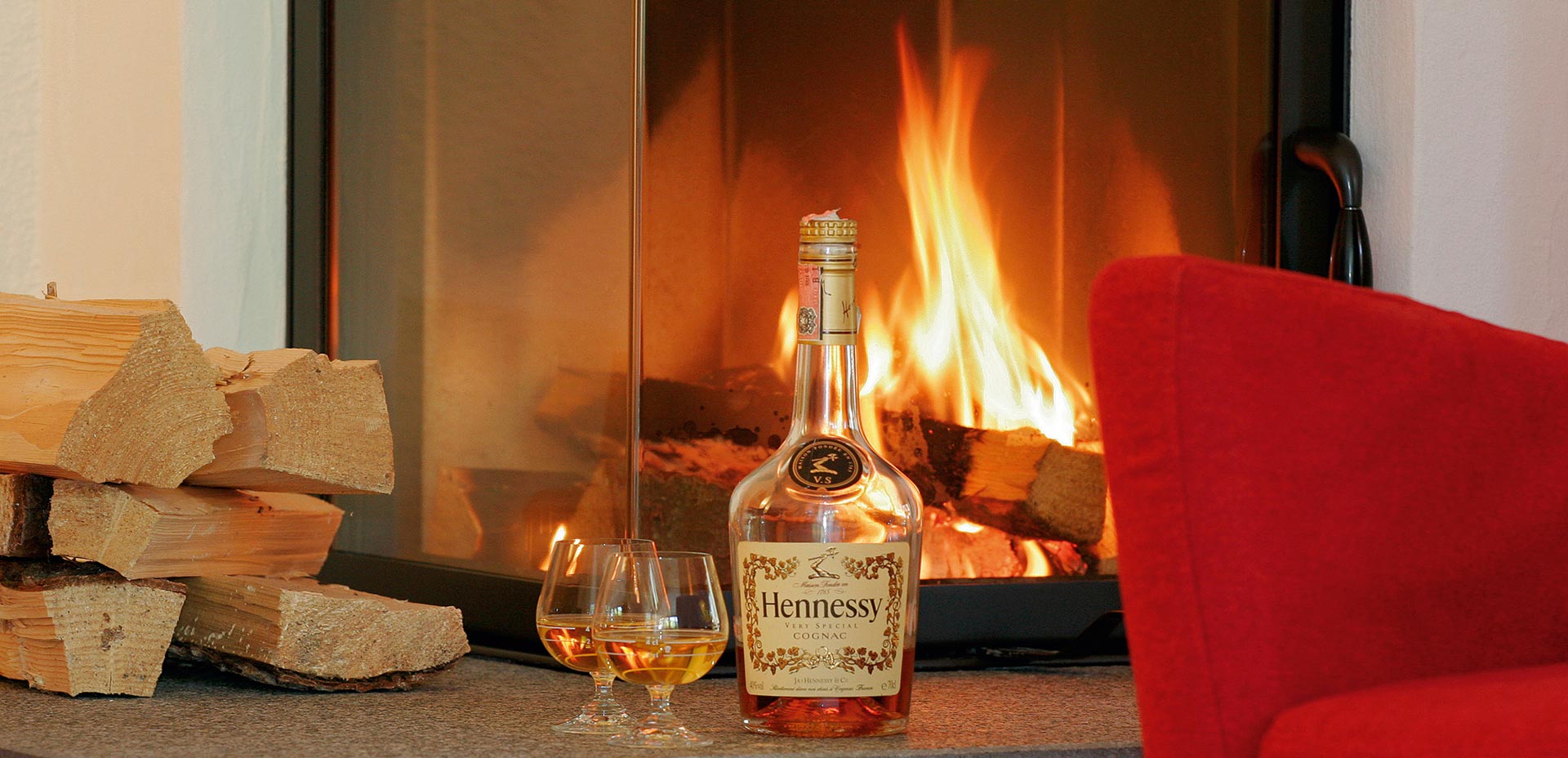 Cozy atmosphere next to the fire, with a glass of good Cognac